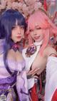 A couple of women dressed in costumes posing for a picture.